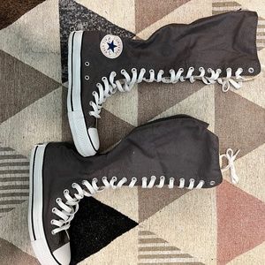 Knee high women converse shoes.